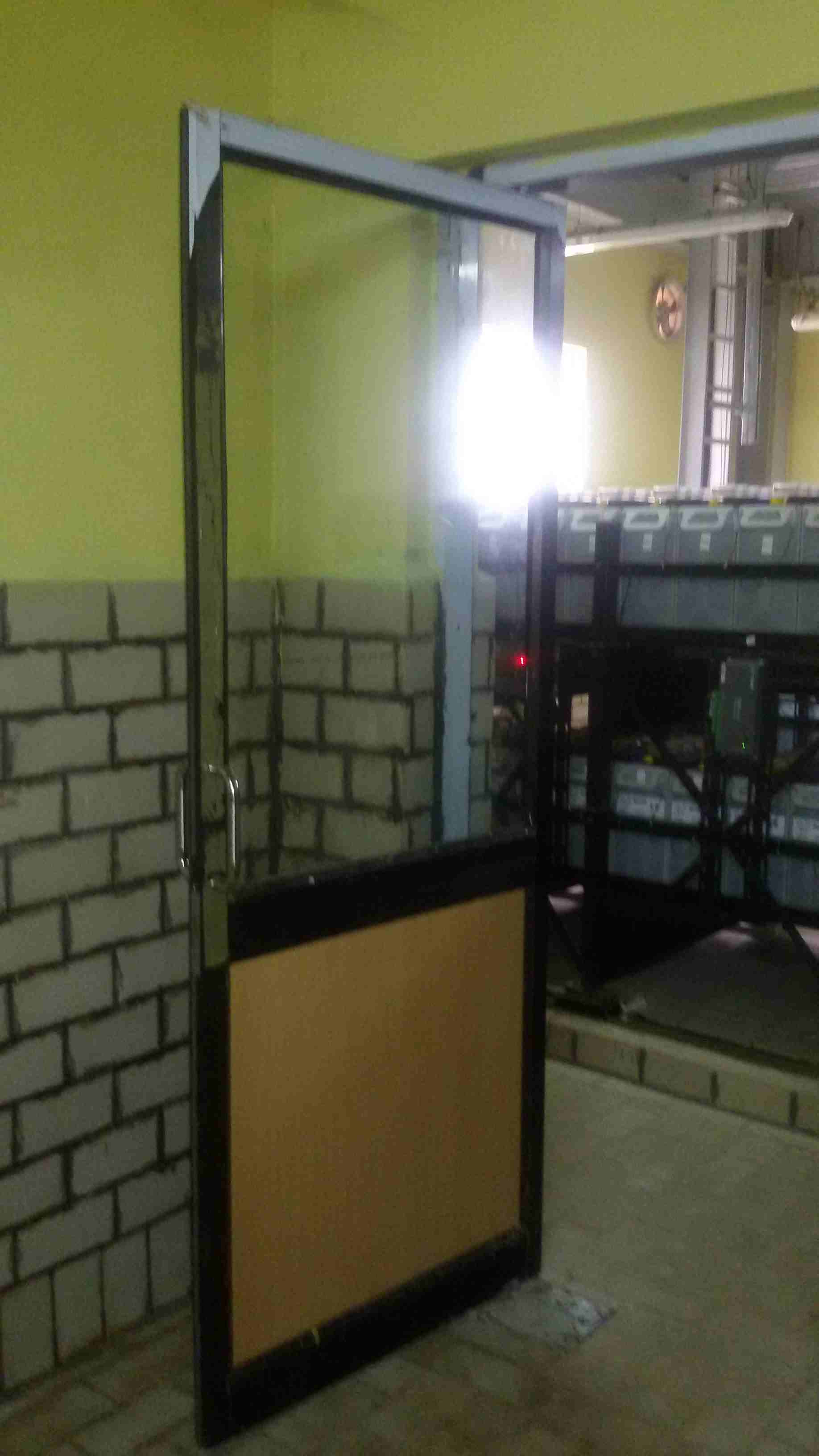 Secure battery room facility designed with proper ventilation and safety measures to house large-scale DC power backup systems for critical infrastructure.