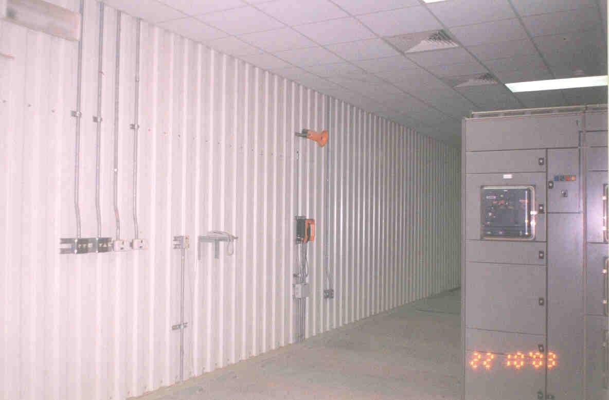 Main cable tray headers exiting the Switchgear (SWGR) room, distributing power to various plant loads.