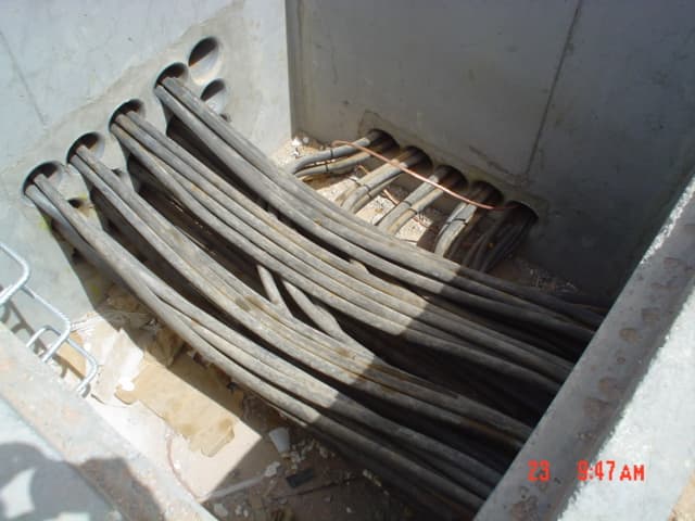 Engineered arrangement for Low Voltage (LV) and Medium Voltage (MV) power cable entry, featuring proper sealing and strain relief.