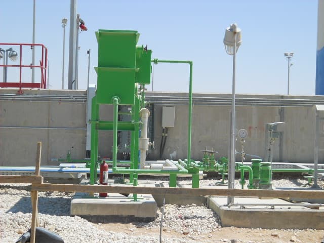 Integrated outdoor filtration and pumping unit installation for industrial water treatment, complete with piping and electrical connections.