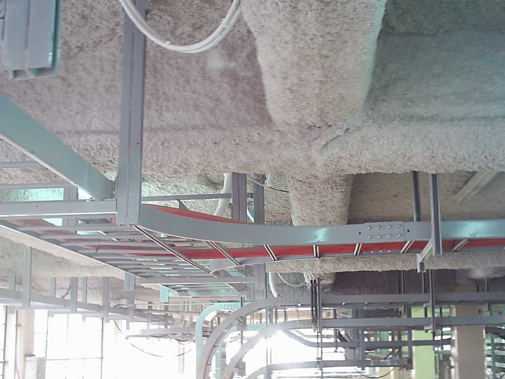 Professional overhead cable tray installation maximizing floor space while providing accessible and secure routing for main power distribution lines.