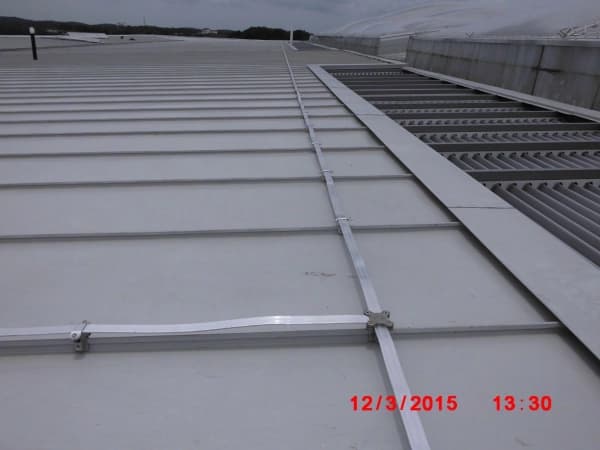 Heavy-duty industrial rooftop structure supporting various utility equipment and accessible walkways.