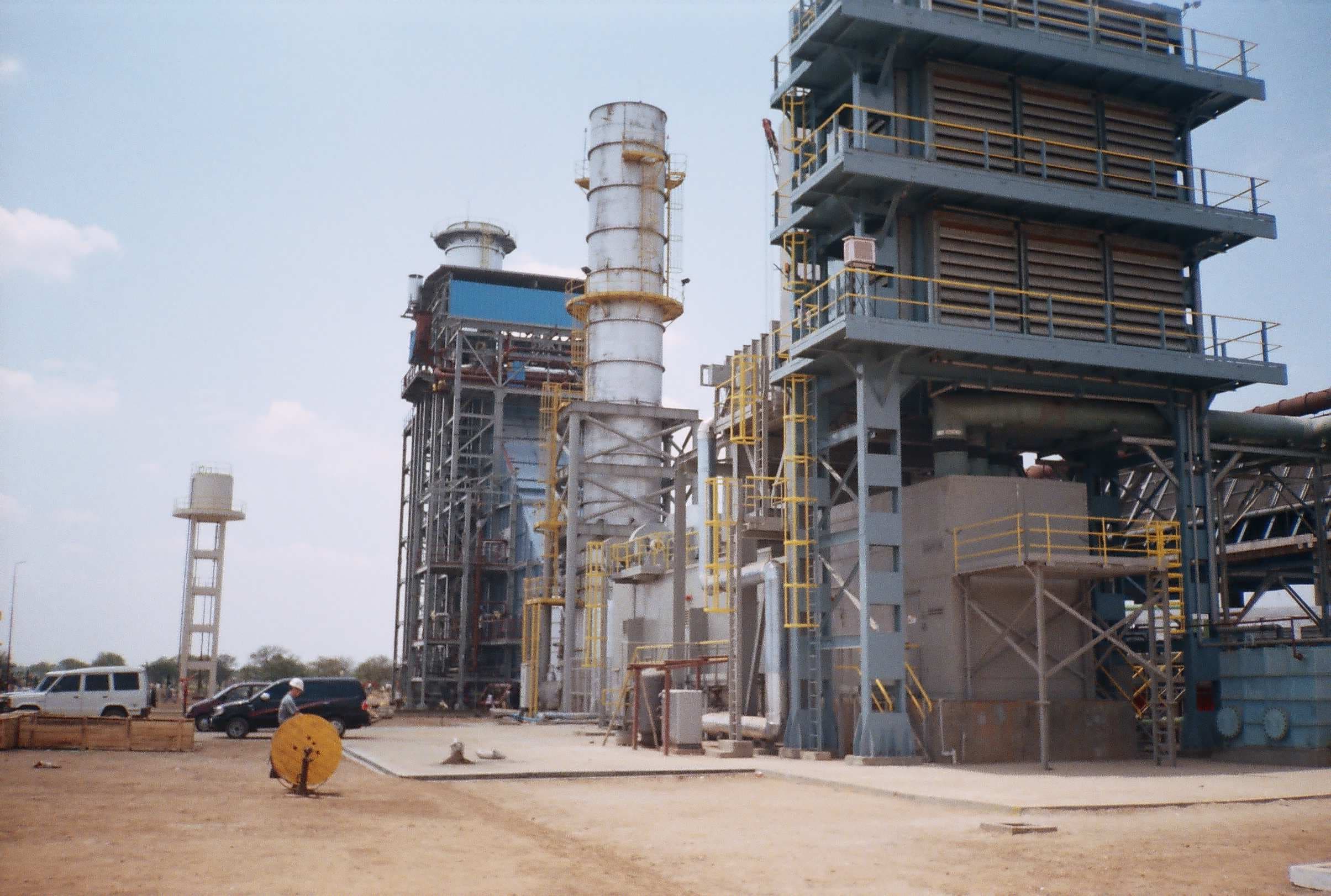 Process of laying underground cables in a prepared trench, ensuring proper spacing and bedding protection.