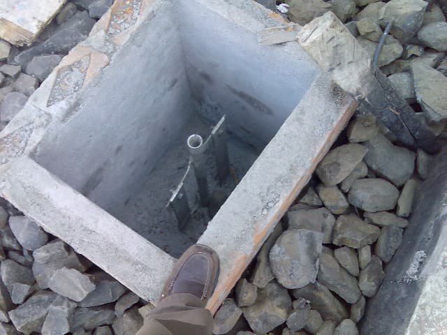 Inspection view of an earth pit showing the electrode connection and cover, facilitating easy maintenance and resistance testing.
